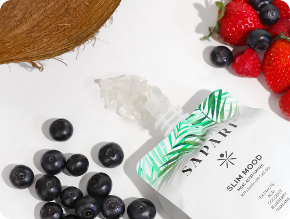 Packet of SLIM MOOD surrounded by blueberries, strawberries, coconut, and raspberries on a white background.