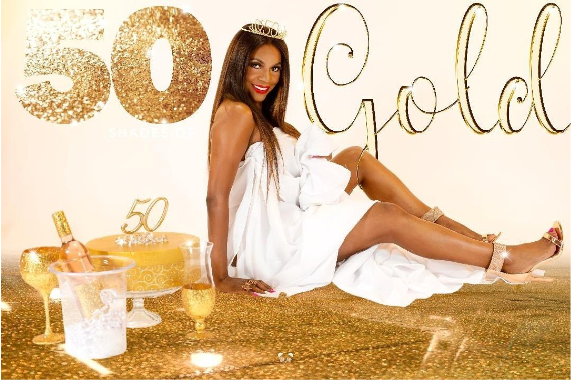 Woman in white dress seated, celebrating '50 Shades of Gold.'