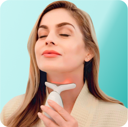 Woman using a neck and face lifting device with a soothing expression.