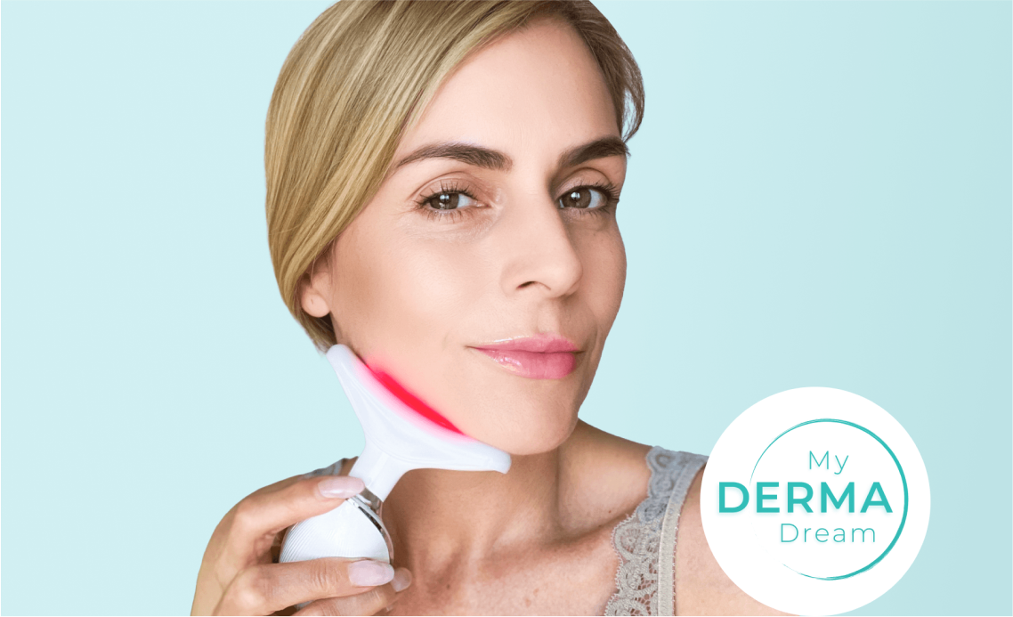 Woman using a skincare device on her face with a gentle smile.