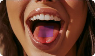 Close-up of a woman with a purple square on her tongue.