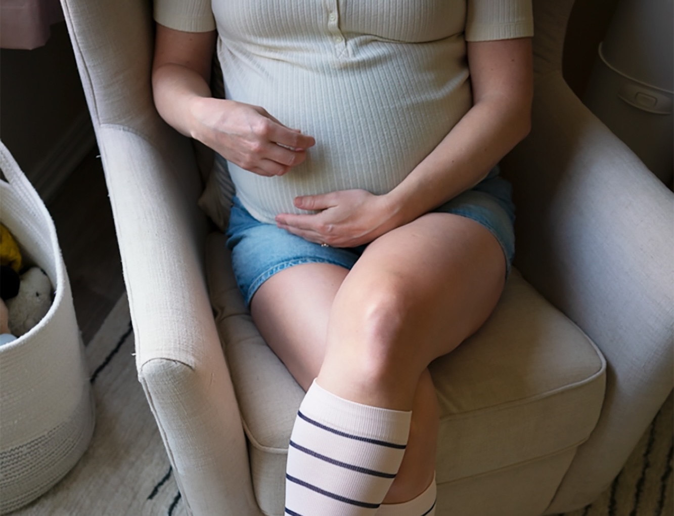 Pregnant woman holding belly