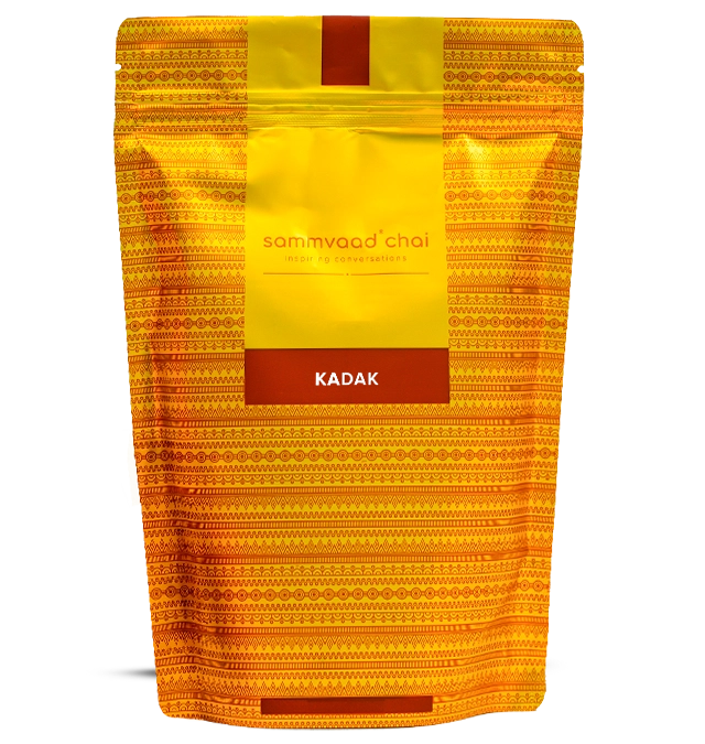 Yellow and orange patterned tea bag labeled 'sammvaad chai kadak'.