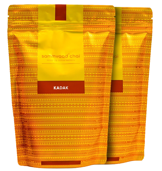 Two yellow patterned chai packaging bags labeled 'Sammvaad Chai Kadak'.