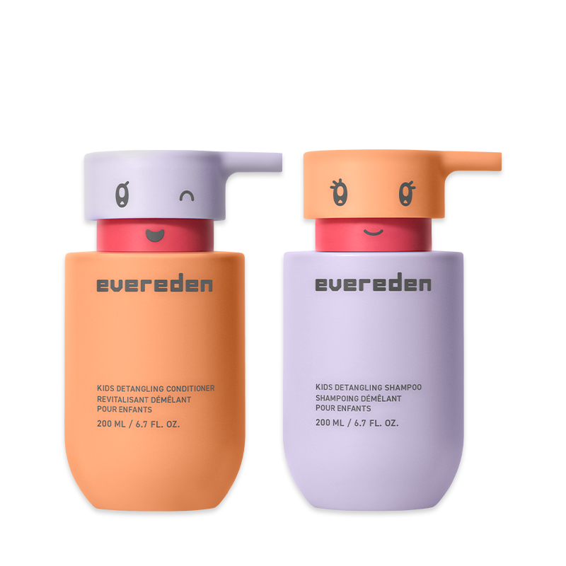 Two colorful pump bottles of Evereden kids shampoo and conditioner with cute character faces on the lids.