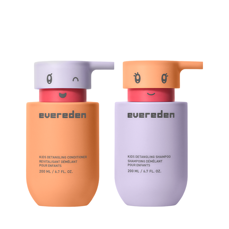 Two bottles of Evereden kids' detangling shampoo and conditioner with cute, character-faced pump dispensers.