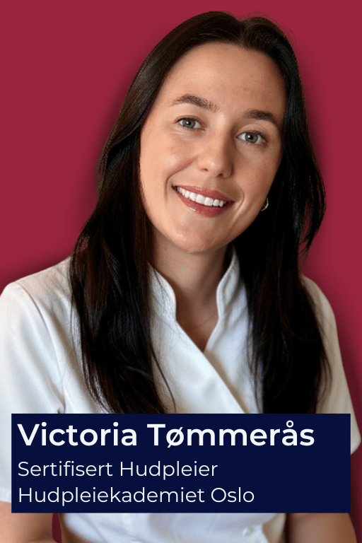 Woman in white uniform with dark hair smiling against a red background.