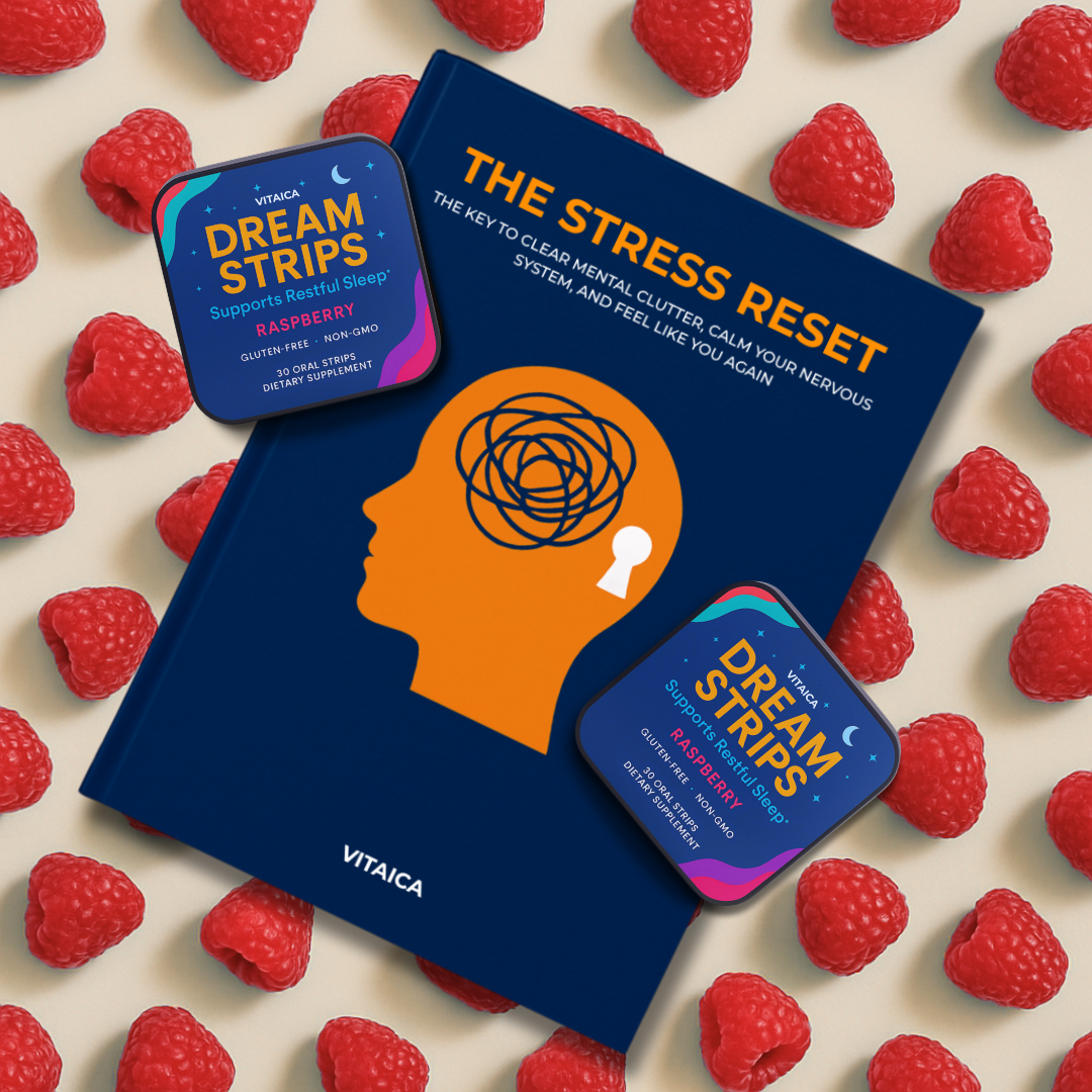 Book titled 'The Stress Reset' with raspberries and Dream Strips packaging.