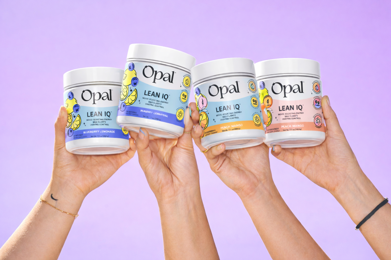 Four hands hold up four tubs of Opal Lean IQ supplements in different flavors against a purple background.
