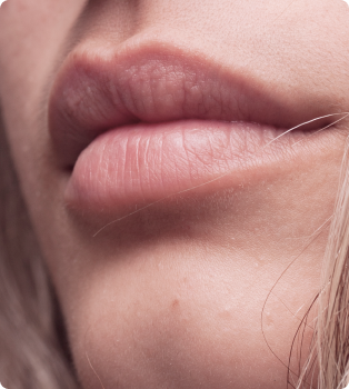 Close-up of a person's lips and chin.
