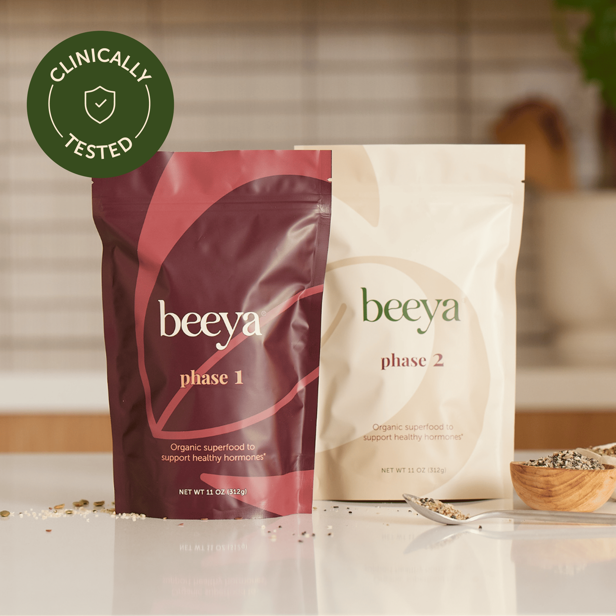 Two Beeya product bags labeled Phase 1 and Phase 2 on a kitchen counter.
