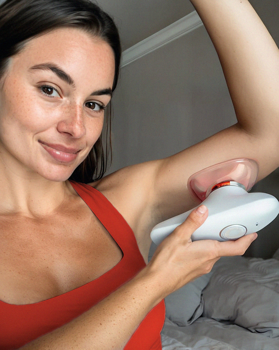 Person using a handheld device on their underarm.