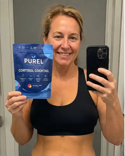 A woman in a sports bra takes a mirror selfie holding a bag of Purel Cortisol Cocktail.