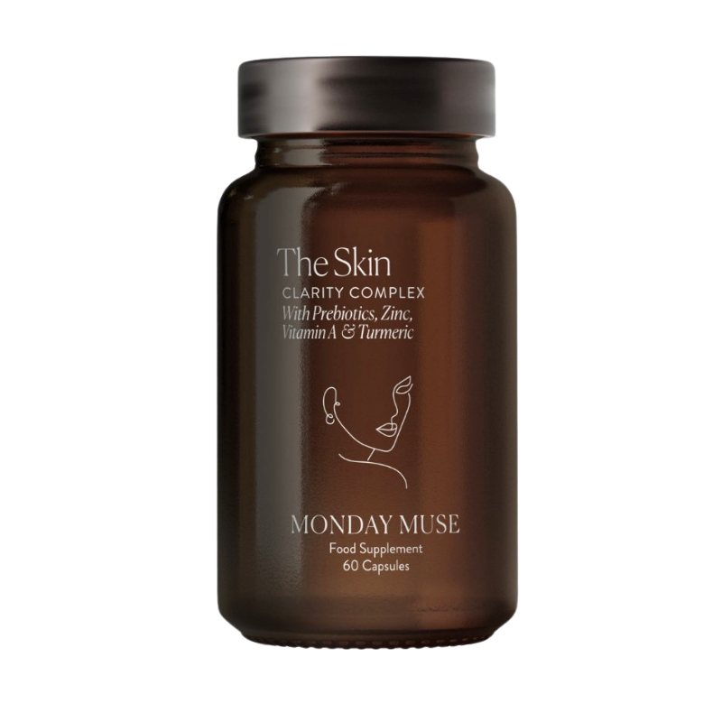 A brown bottle of Monday Muse The Skin Clarity Complex food supplement against a white background.
