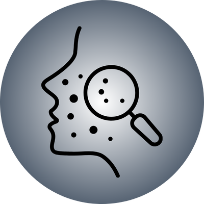 Outline of a face with a magnifying glass, showing skin blemishes.