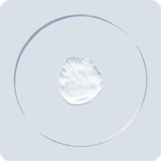 White, textured circle on a light gray background.