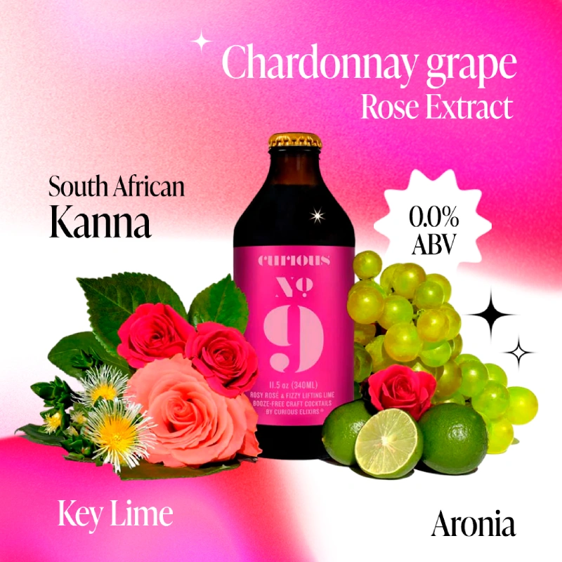 A bottle of Curious No. 9 surrounded by its ingredients: roses, grapes, and limes, on a pink background.