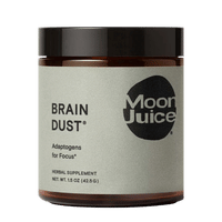 A jar labeled 'Brain Dust' by Moon Juice, herbal supplement.