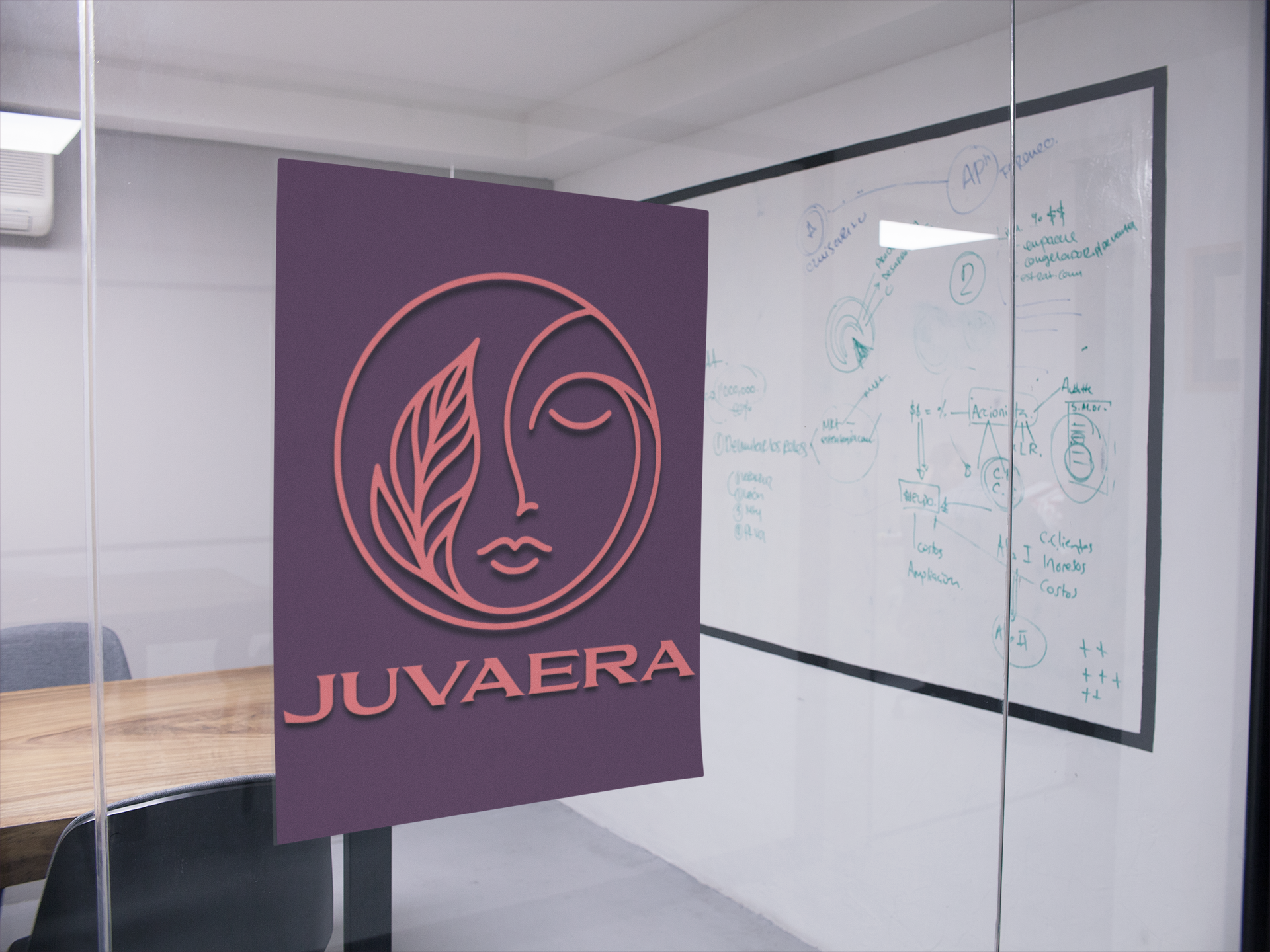 A purple decal with the JUVAERA logo on a glass office door, with a whiteboard in the background.