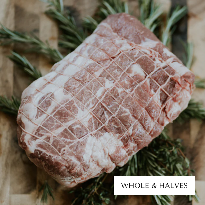 Raw marbled meat with netting on rosemary, labeled 'Whole & Halves'.