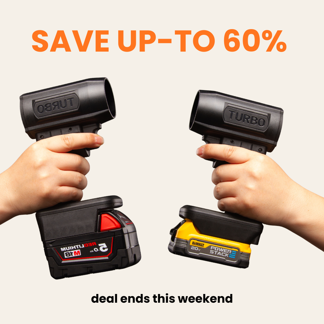 Two hands holding black cordless Turbo tools, one with a Milwaukee battery and the other with a DeWalt.
