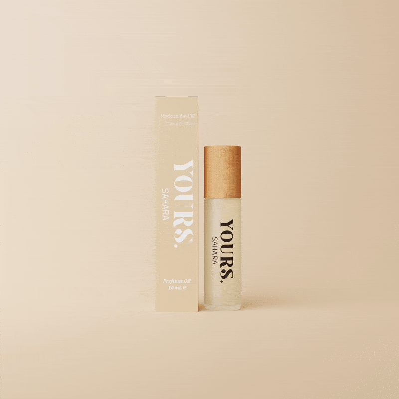 Perfume bottle labeled 'YOURS. SAHARA' with matching box on a beige background.