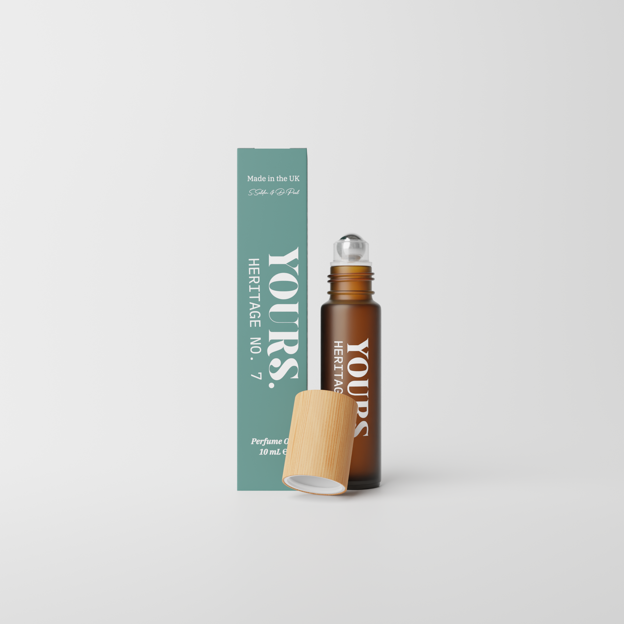 Brown glass bottle with wooden cap, next to teal box labeled 'Yours Heritage No. 7'.