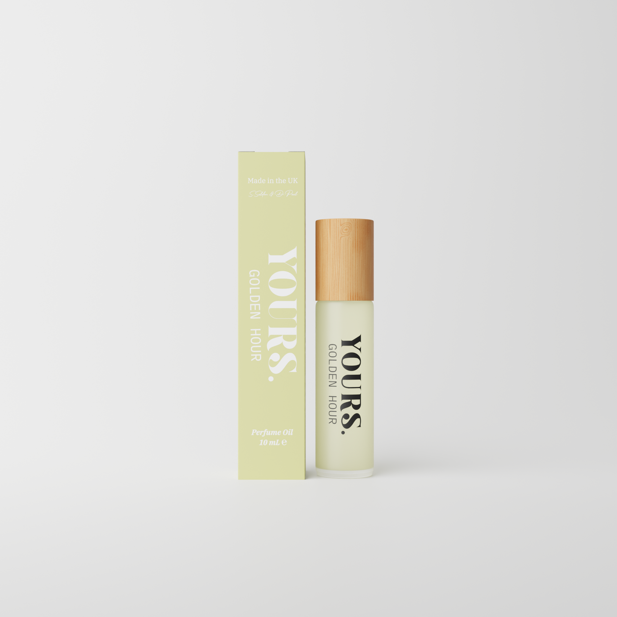 Perfume oil bottle and box labeled 'YOURS. GOLDEN HOUR' on a white background.