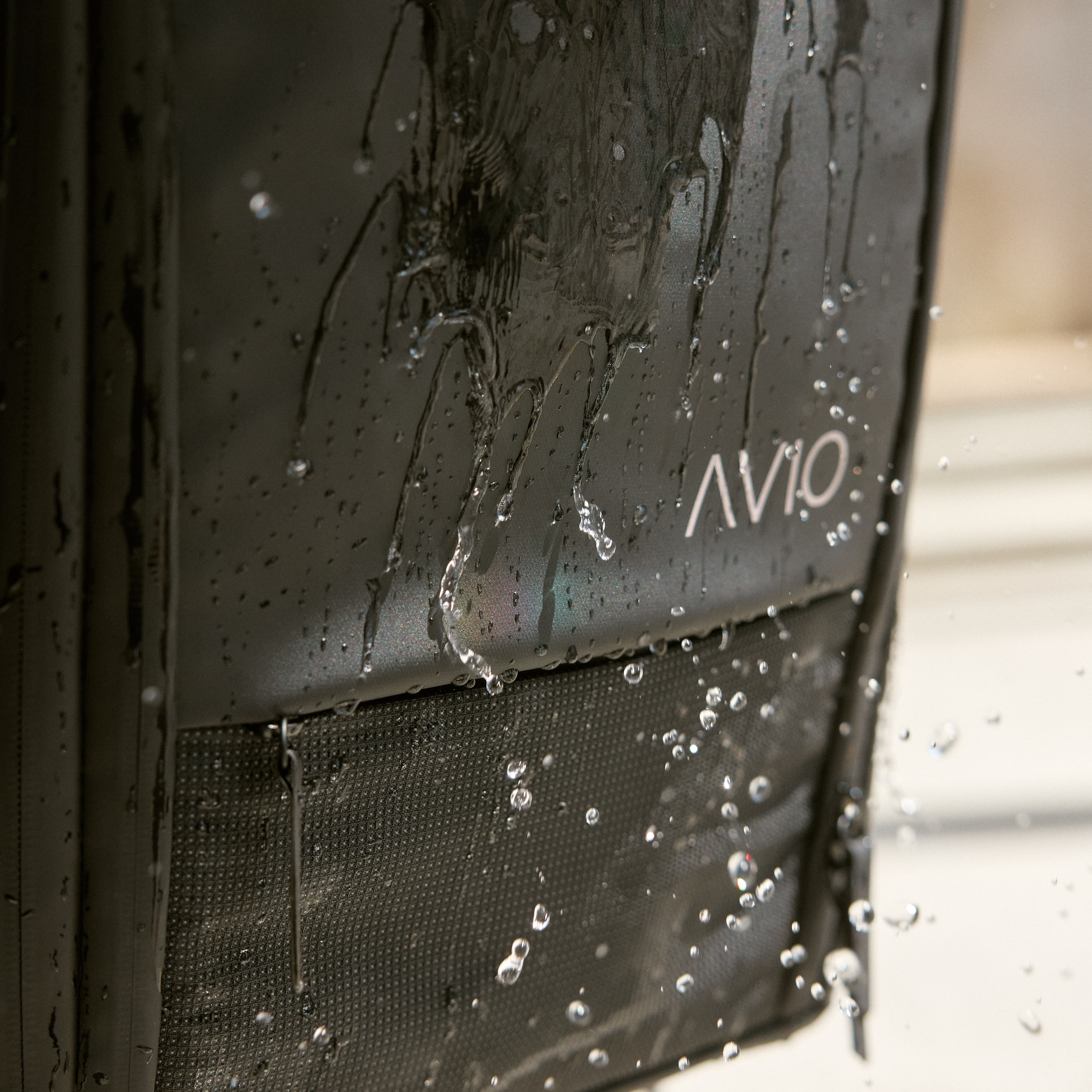 Black bag with water droplets and 'AVIO' text.