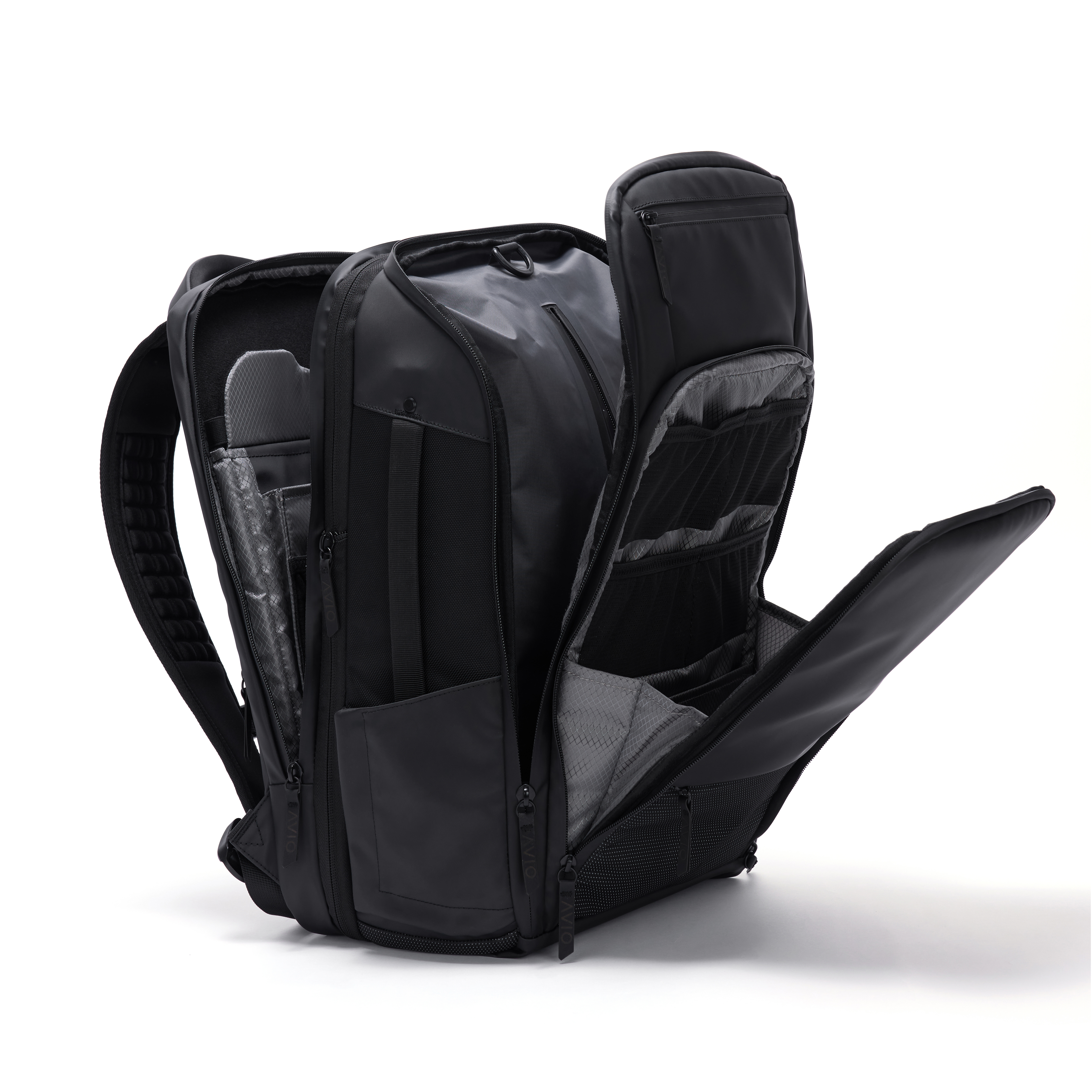 Black backpack with multiple open compartments and zippers.