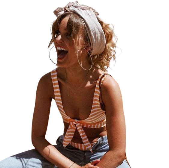 Smiling woman in striped top and headscarf.