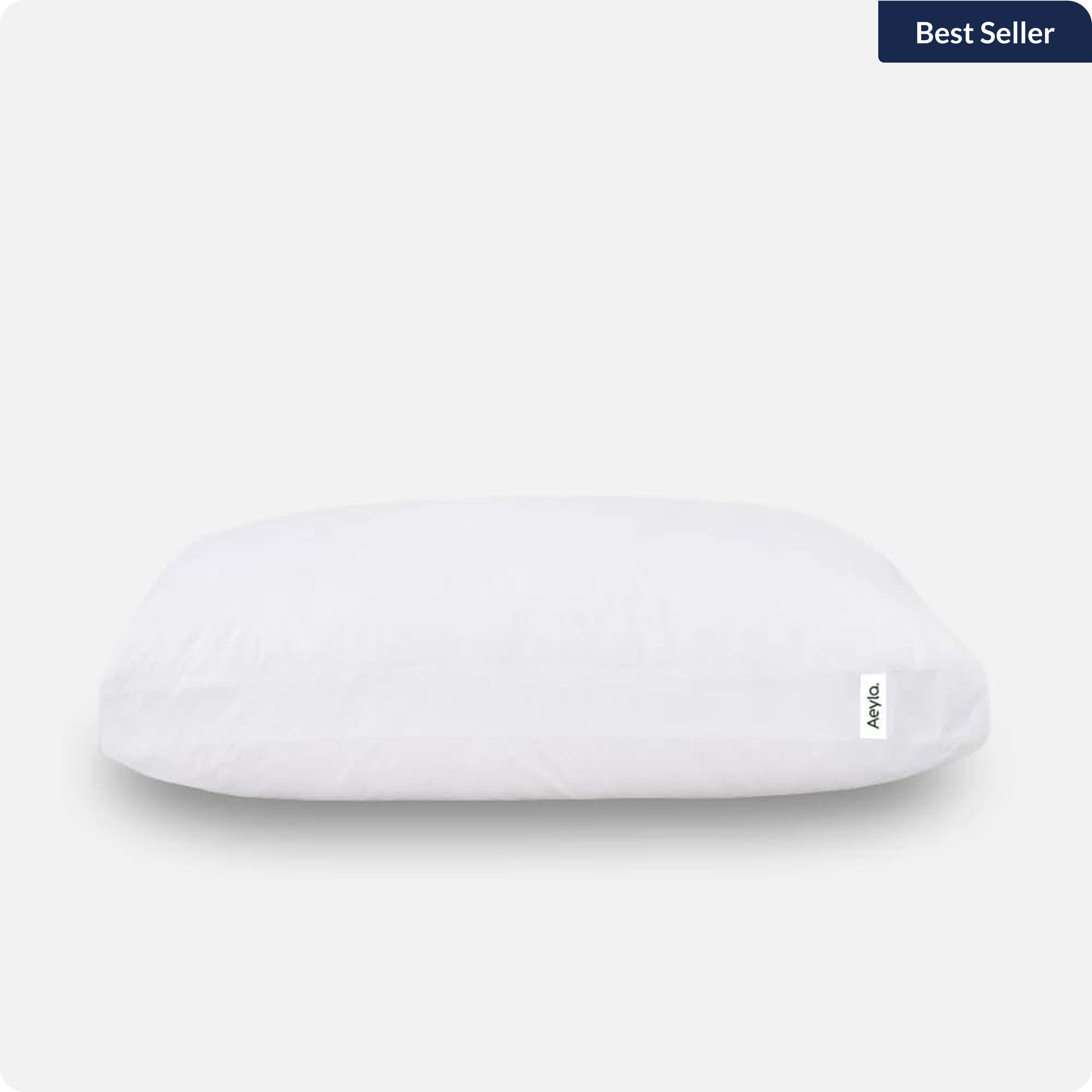 A single white pillow with an 'Aeyla' brand tag, set against a light gray background.