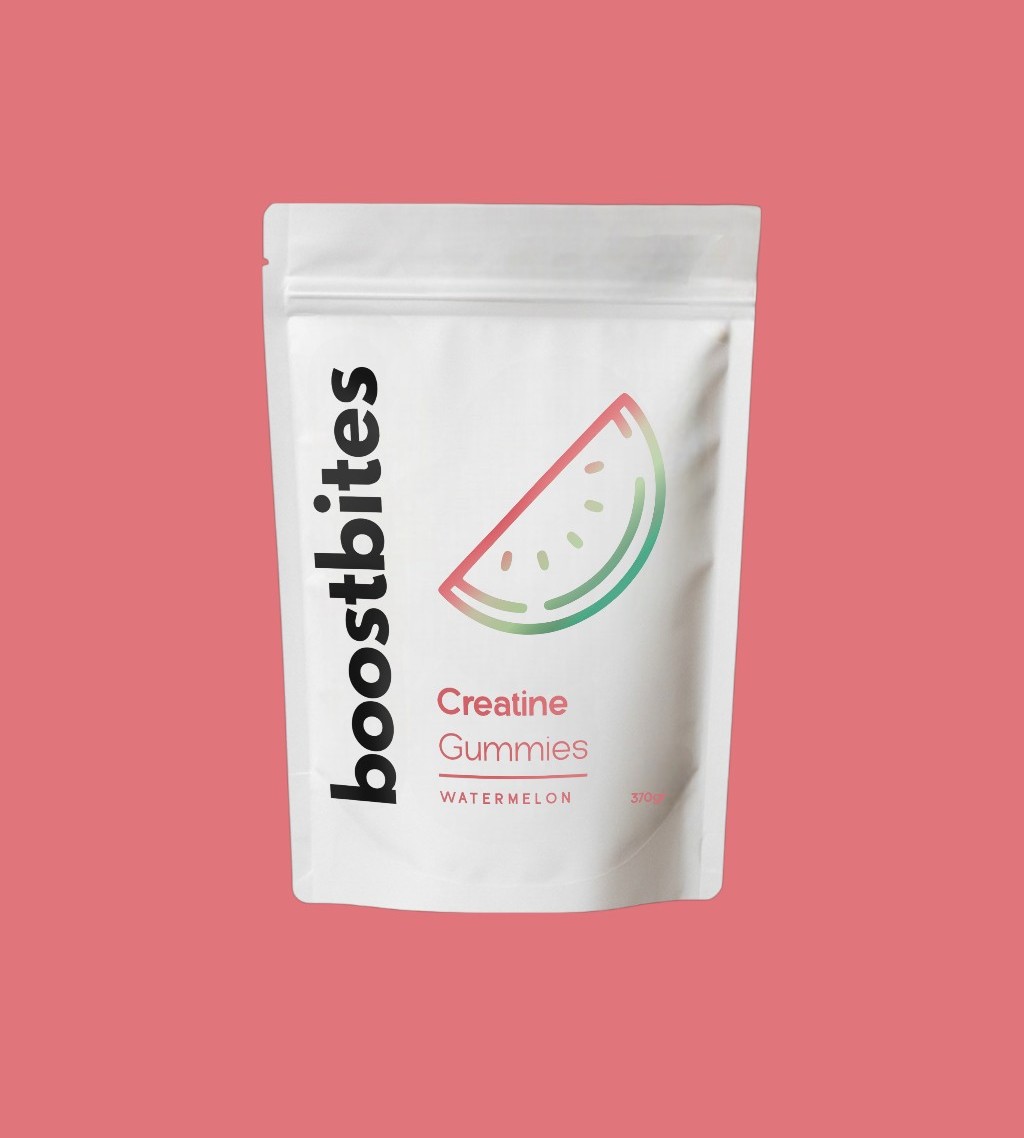 White pouch labeled 'boostbites Creatine Gummies Watermelon' on a pink background.