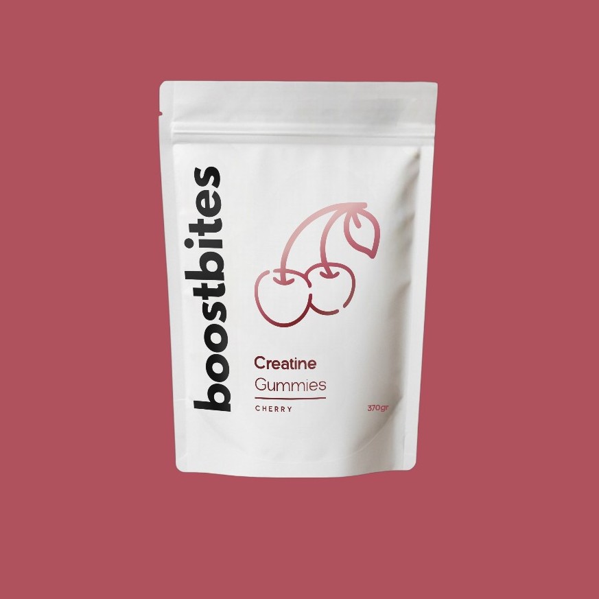 White pouch labeled 'boostbites Creatine Gummies Cherry' with cherry illustration on red background.