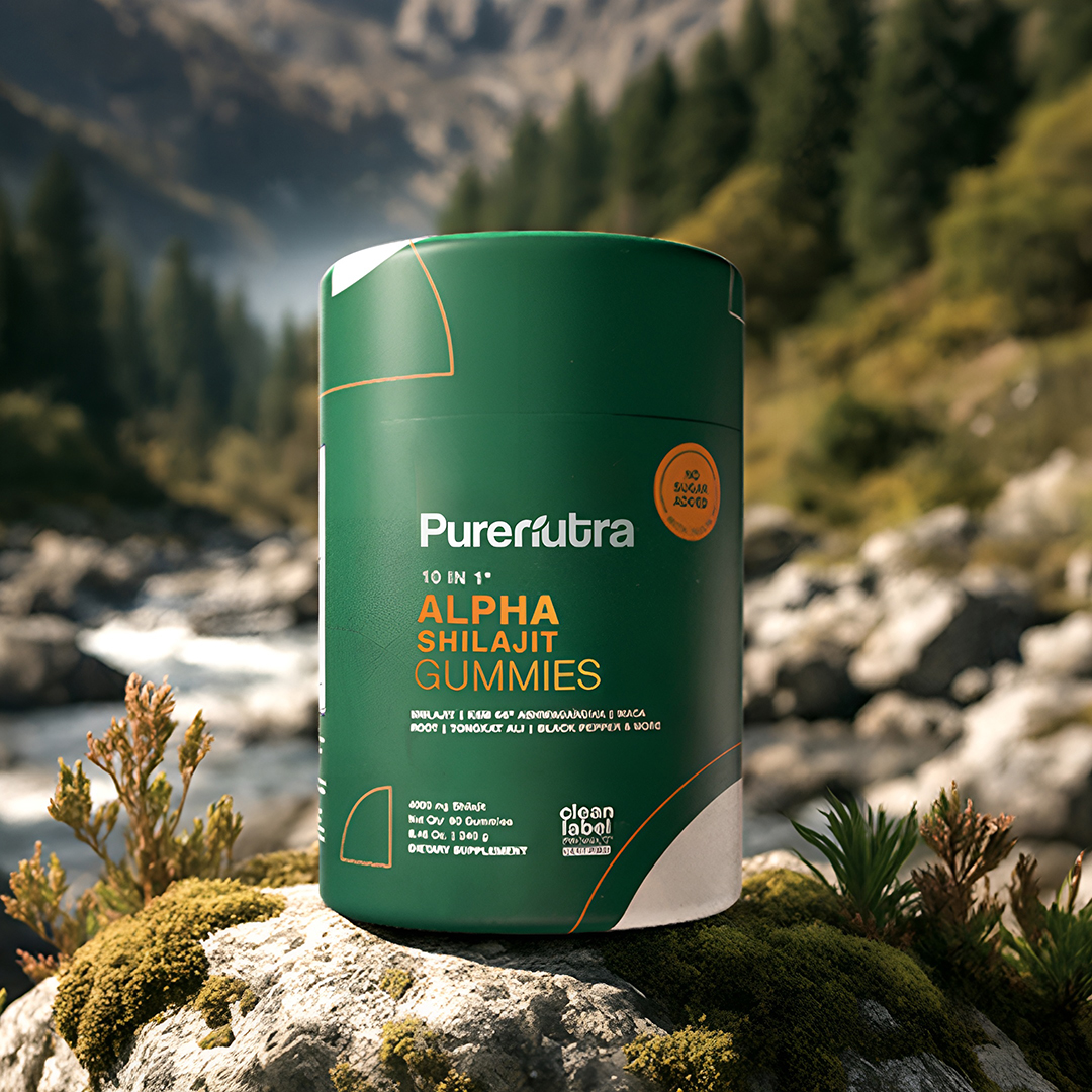 A container of green Alpha Shilajit Gummies outdoors with a forest and mountain background.