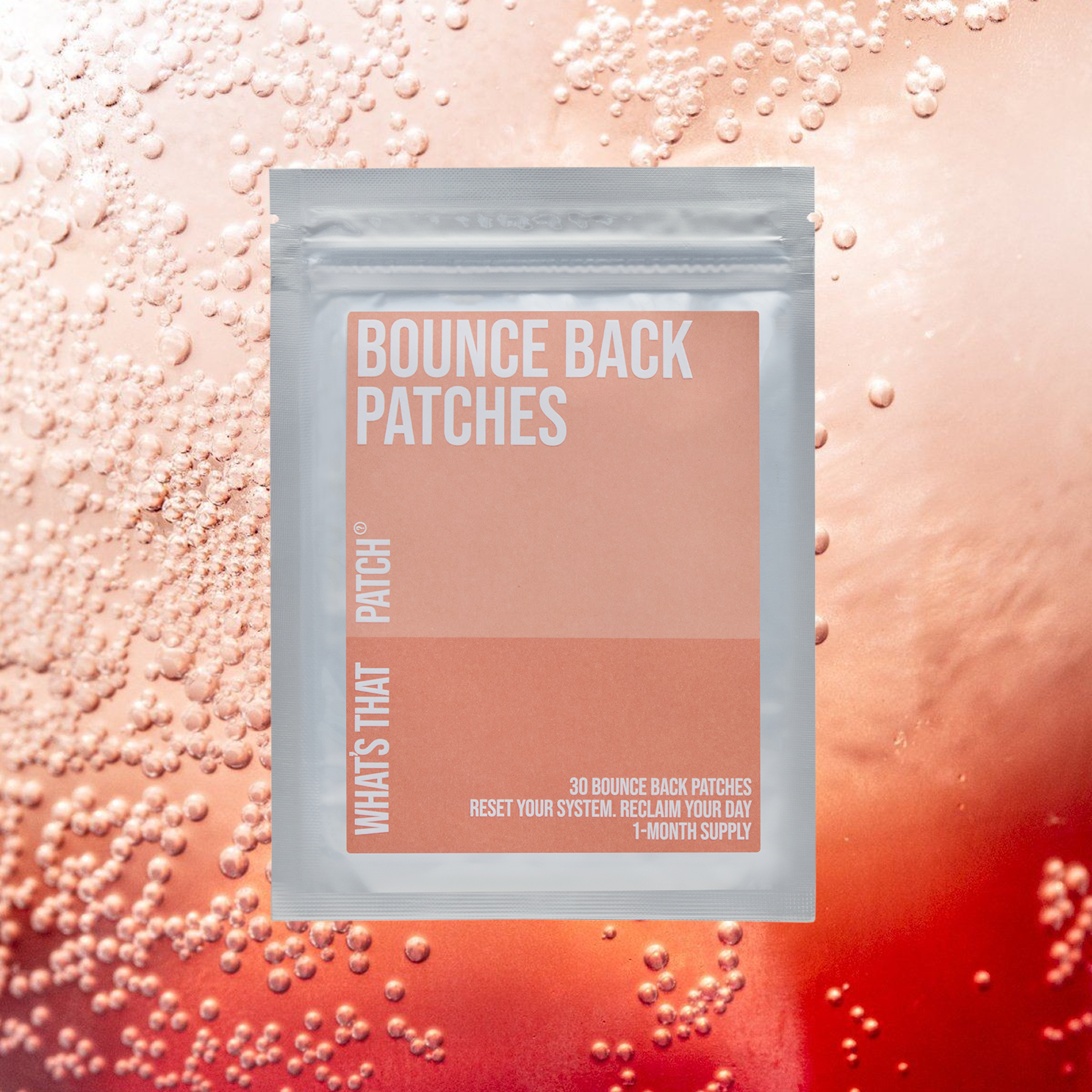A silver pouch of What's That Patch Bounce Back Patches against a bubbly, pinkish-red liquid background.