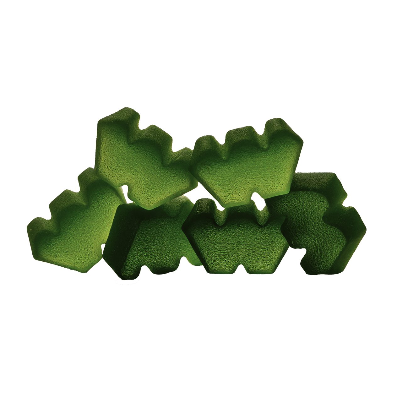 A small pile of green, tree-shaped gummy candies on a black background.
