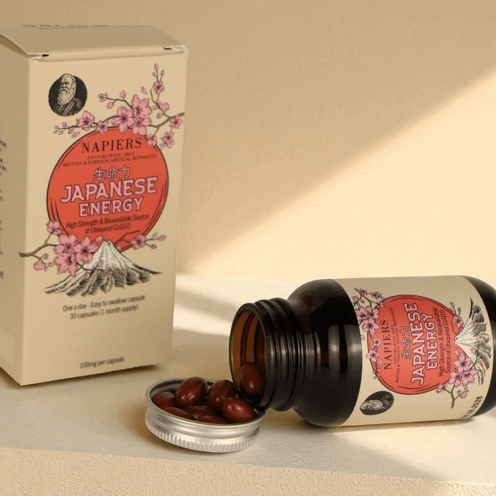 Bottle and box of Japanese Energy capsules with cherry blossom design.