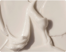 Close-up of smooth, creamy white substance with swirling texture.