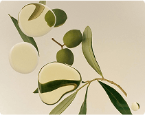 Green olives and leaves with abstract oil shapes on a beige background.
