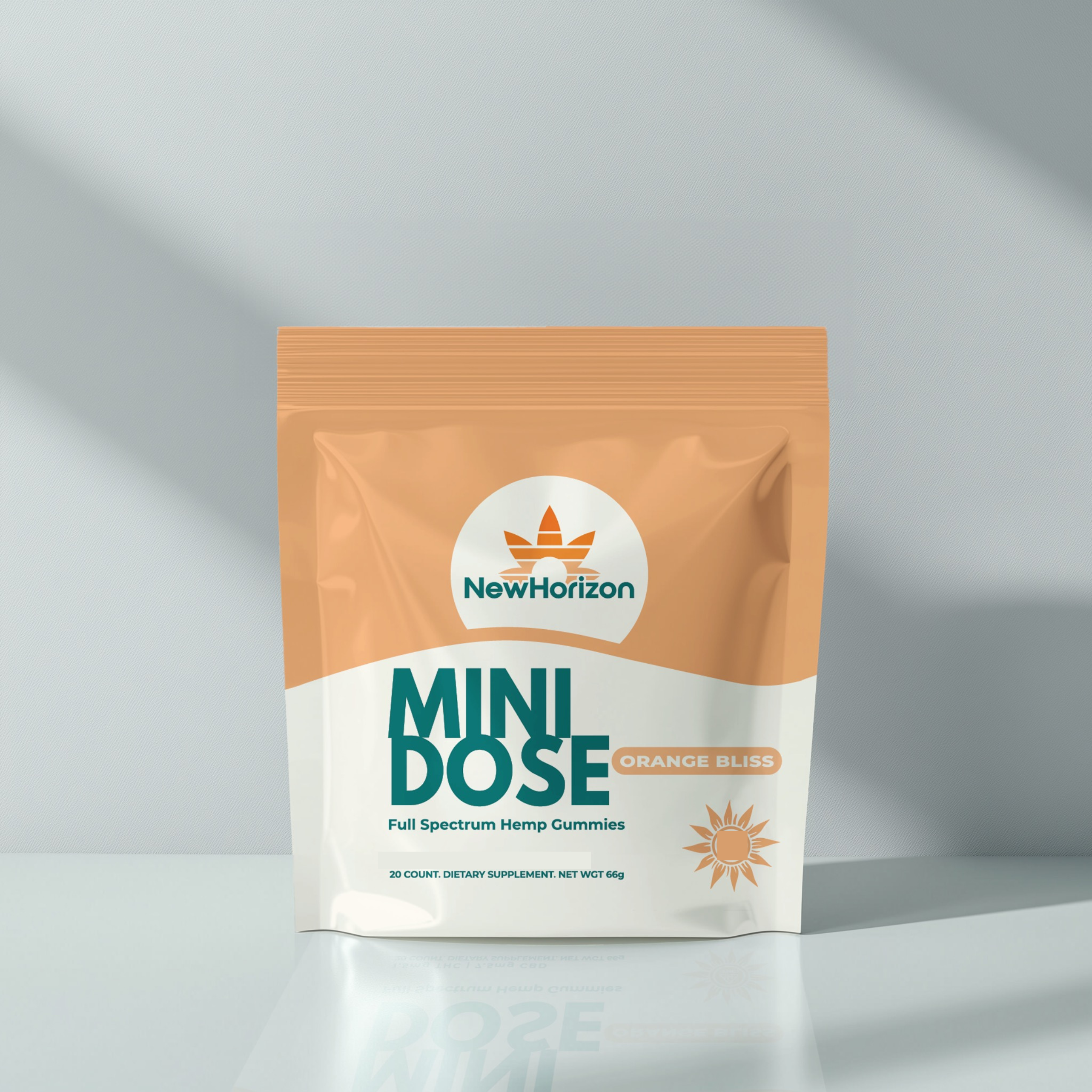 Packaging of NewHorizon Mini Dose Orange Bliss hemp gummies on a reflective surface.