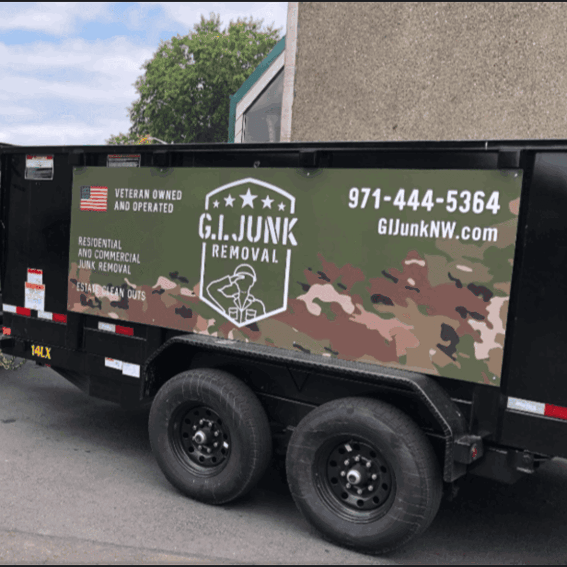 Black trailer with G.I. Junk Removal logo and contact information.
