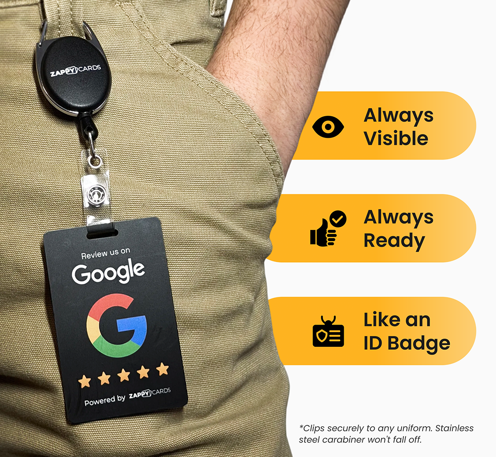 A 'Review us on Google' card from Zappy Cards clipped to a person's pants on a retractable holder.