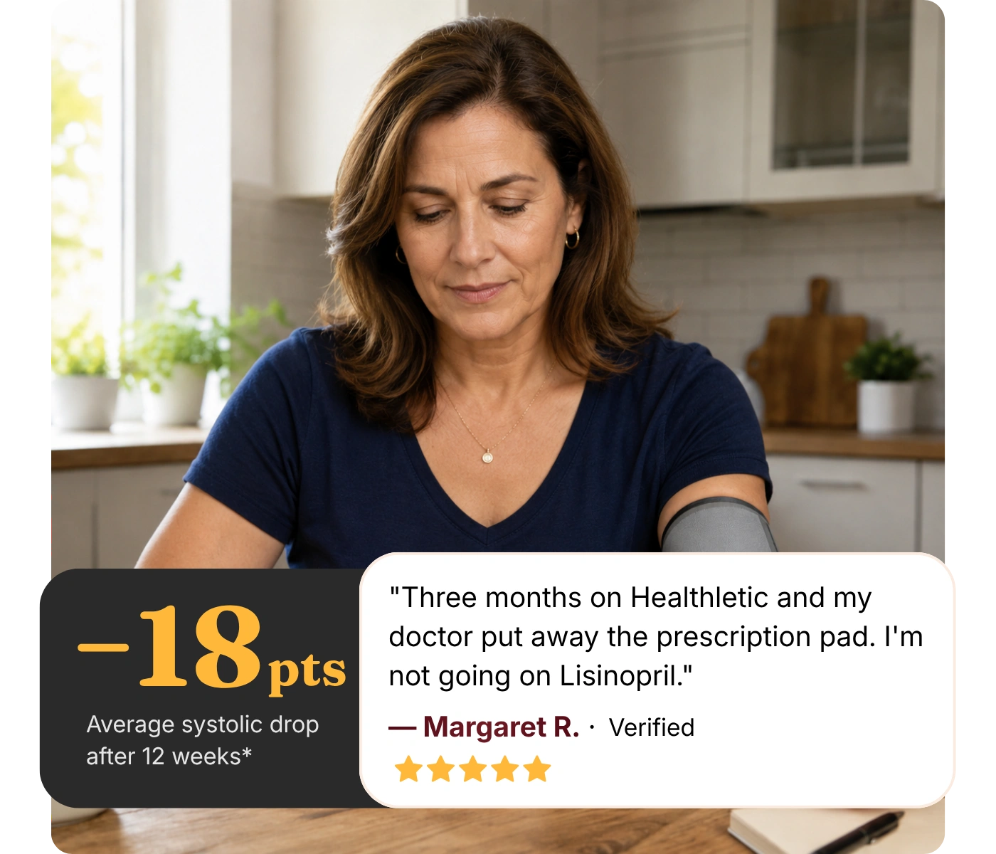 A woman sits at a table in her kitchen with a blood pressure cuff on her arm.