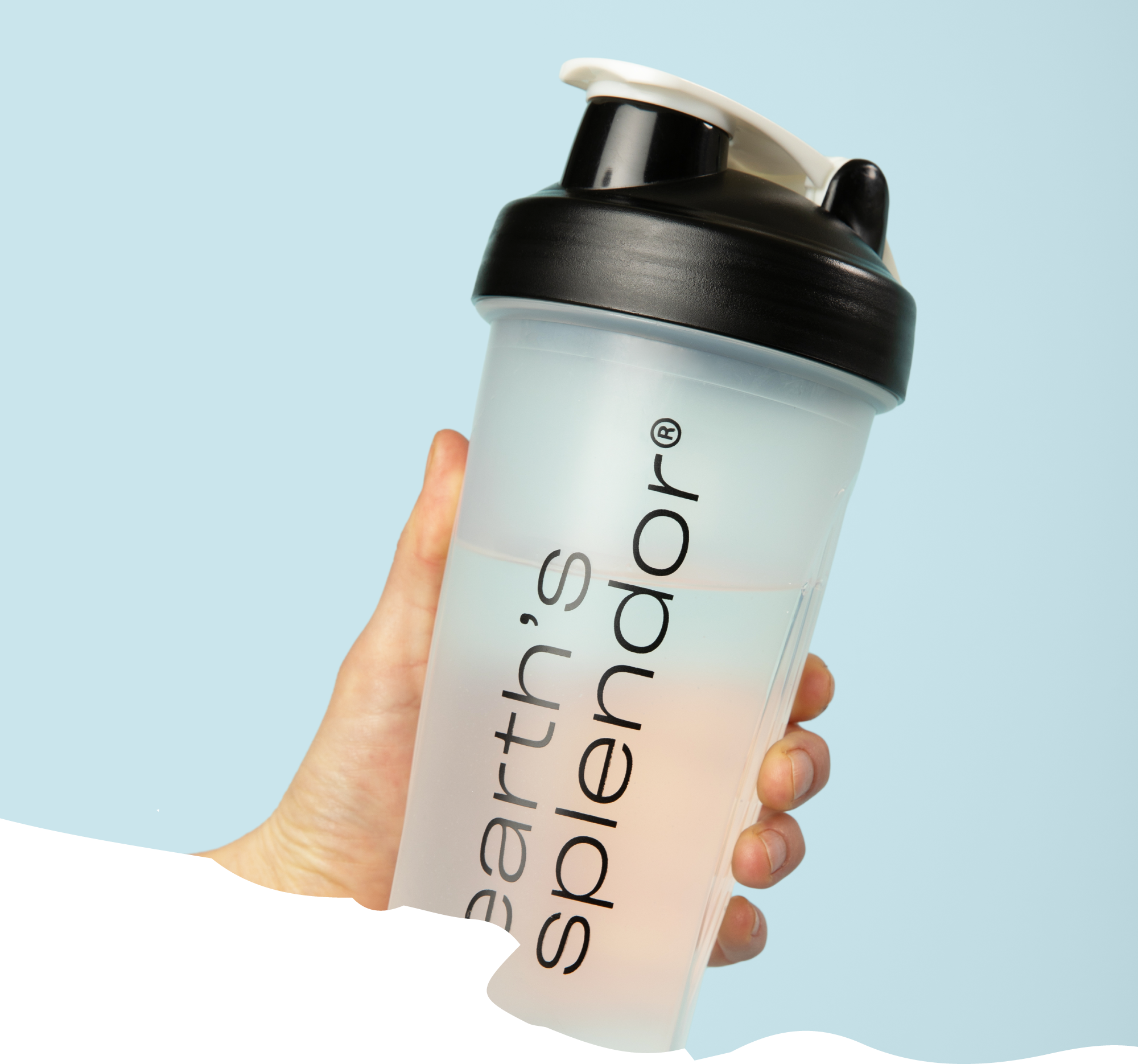 Hand holding a shaker bottle with 'earth's splendor' text.