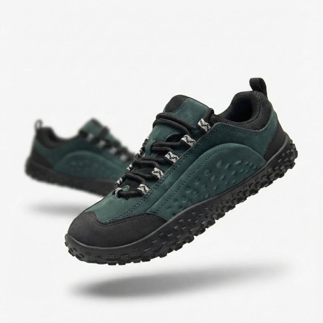 A dark green and black rugged sneaker floating against a plain white background, with another in the background.