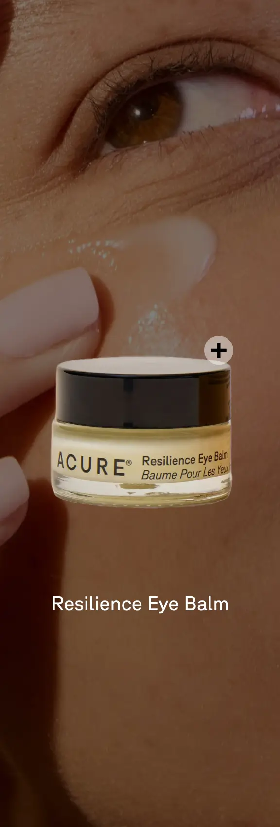 Resilience Eye Balm packaging with a plus sign. The background is a person applying product.
