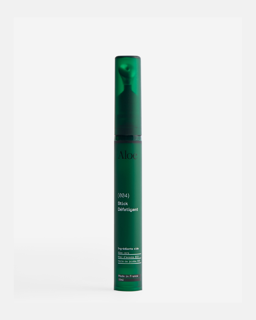 Green cosmetic stick labeled Aloe, with product details.