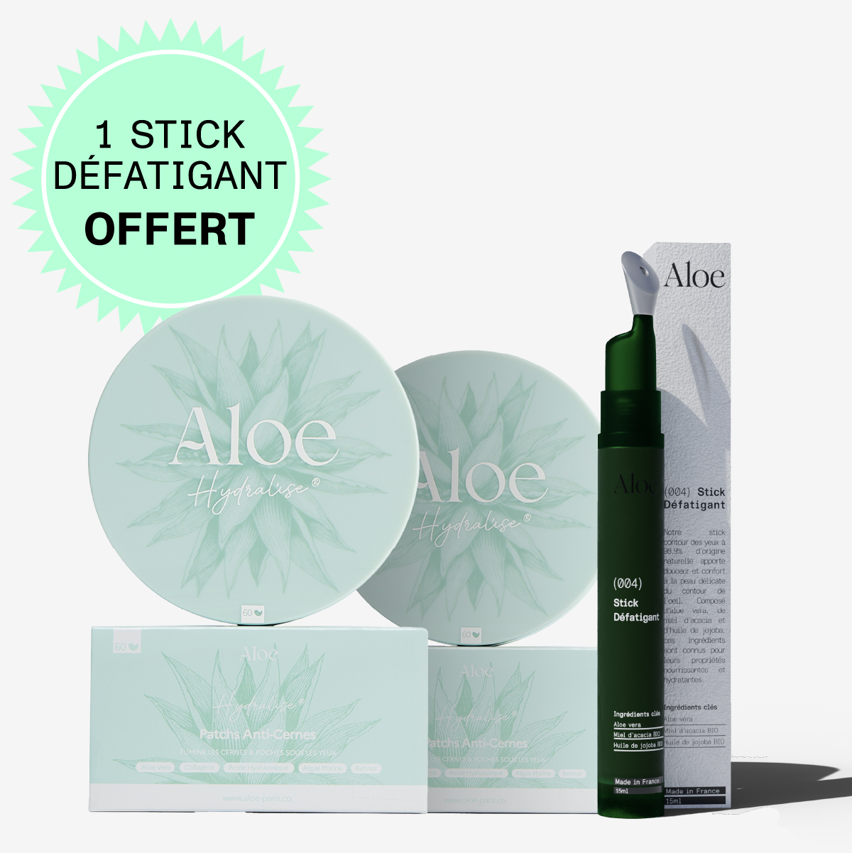 Aloe skincare products display with packaging and promotional text.