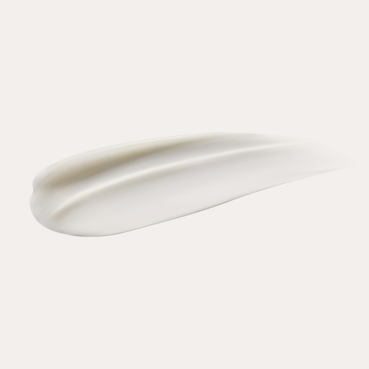 A smooth, white cream smear on a plain background.